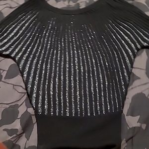 Beautiful sweater,ribbed,black with silver in between ribs. Looks fabulous on